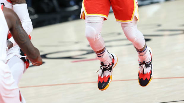 Jan 3, 2022; Portland, Oregon, USA; Atlanta Hawks guard Trae Young (11) shoots a floater against the Portland Trail Blazers in the first half at Moda Center.